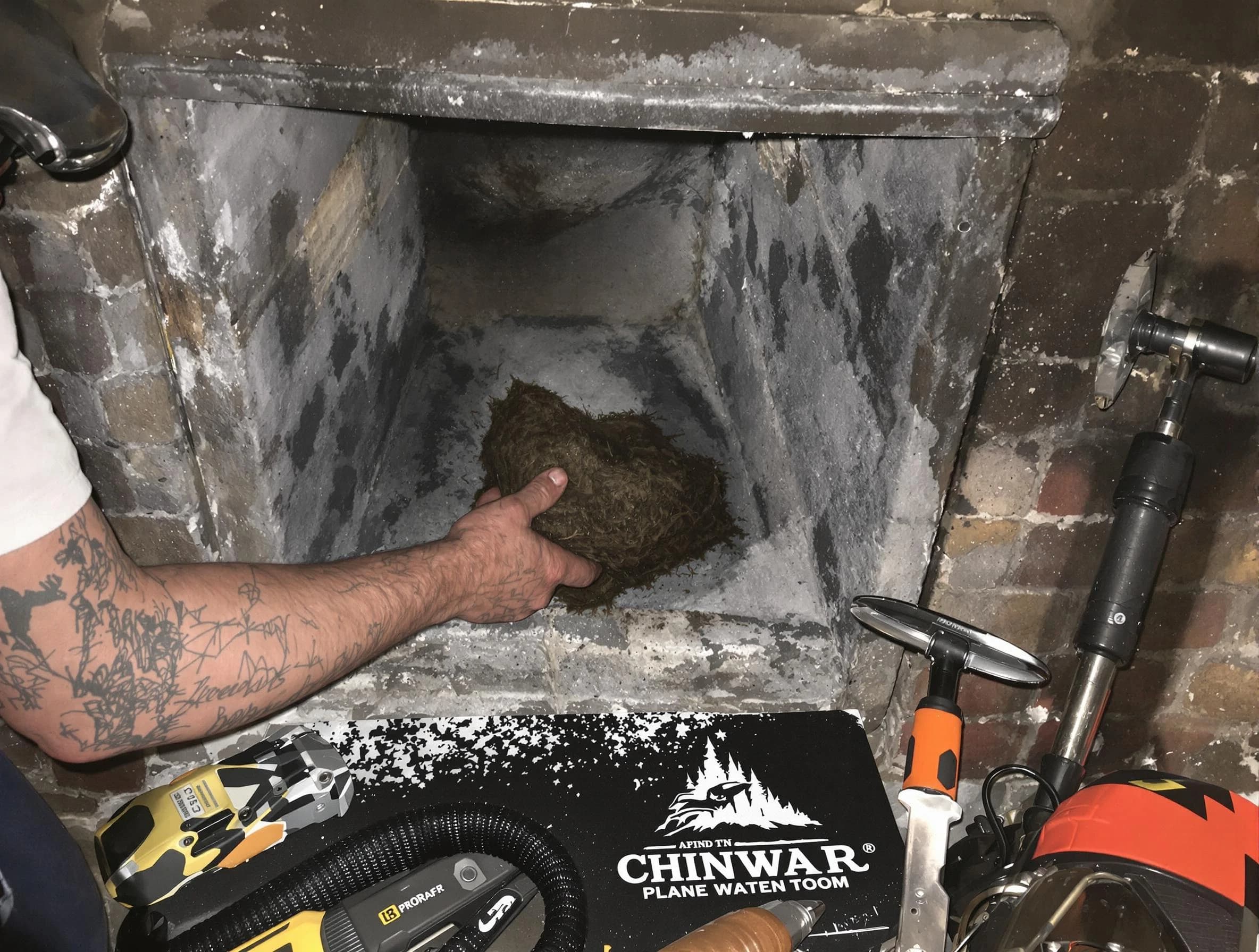 South Park Chimney Sweep safely removing debris and screening chimney in South Park, PA